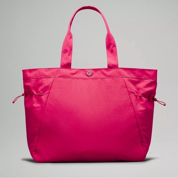 lululemon athletica Handbags - Lululemon Side Cinch Bag NWT - raspberry coulis